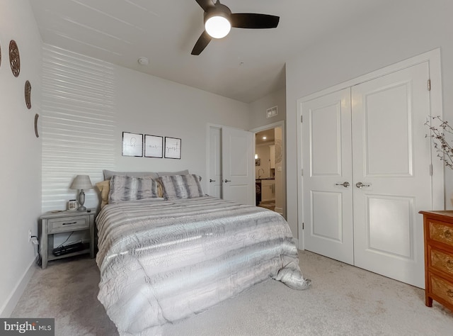 bedroom featuring light carpet, a closet, and ceiling fan