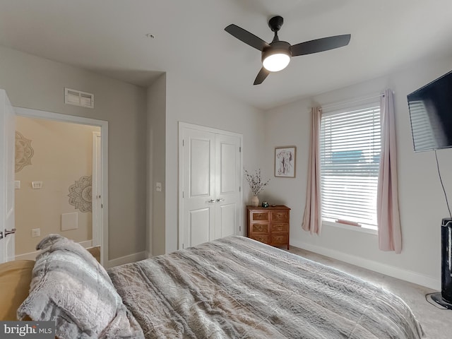 bedroom featuring carpet, ceiling fan, and a closet