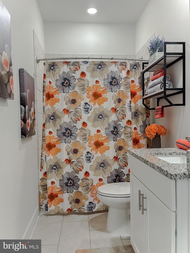 bathroom with a shower with shower curtain, vanity, toilet, and tile patterned flooring