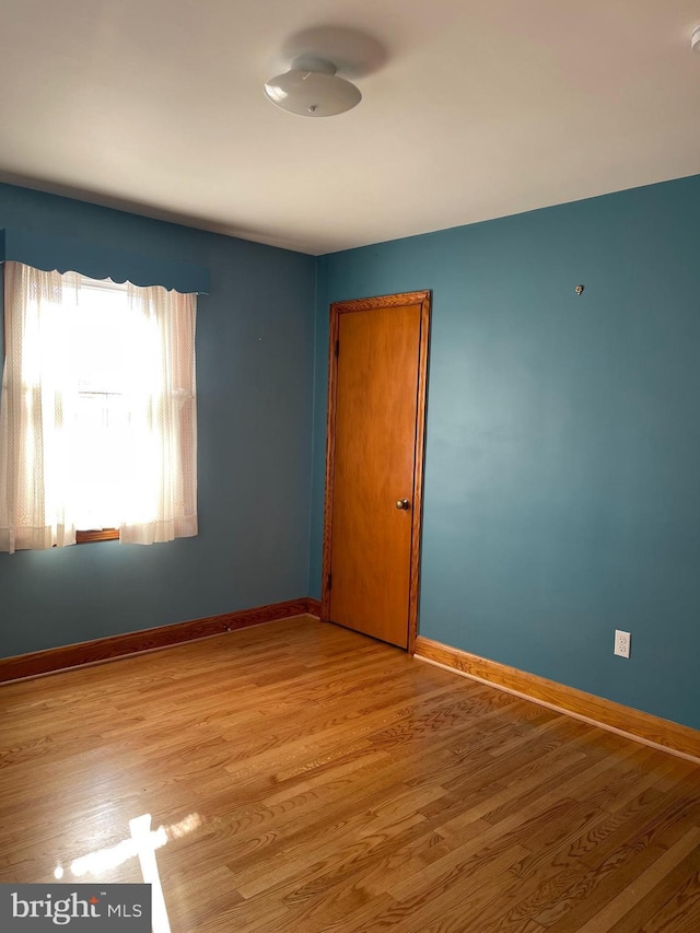 empty room with light wood-type flooring