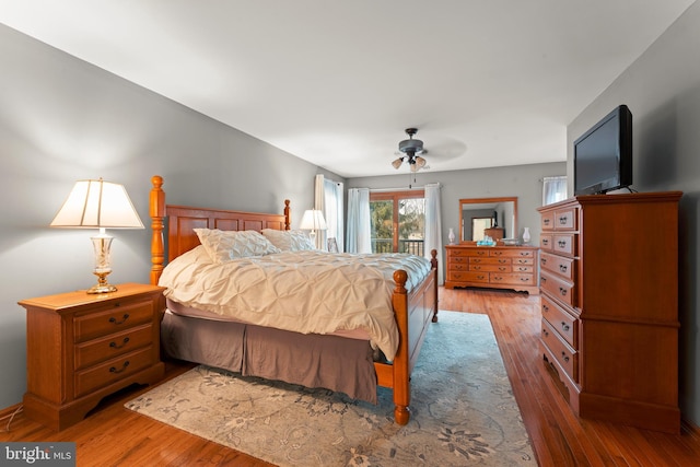 bedroom featuring ceiling fan, access to exterior, and light hardwood / wood-style flooring