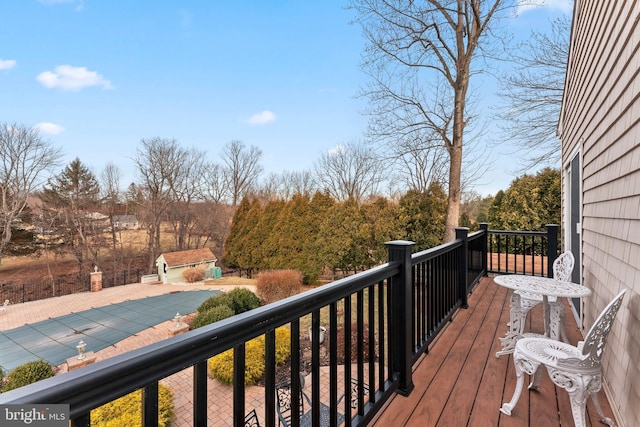 wooden deck with an outbuilding