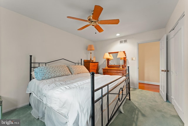 bedroom with ceiling fan and carpet floors