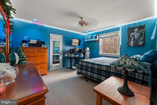 bedroom featuring ceiling fan and carpet flooring