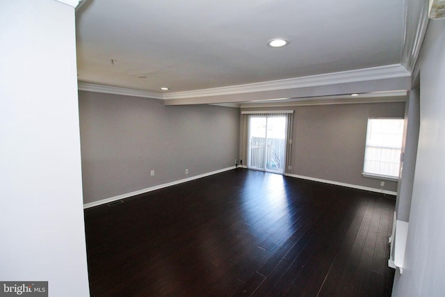 unfurnished room with dark wood-type flooring and ornamental molding