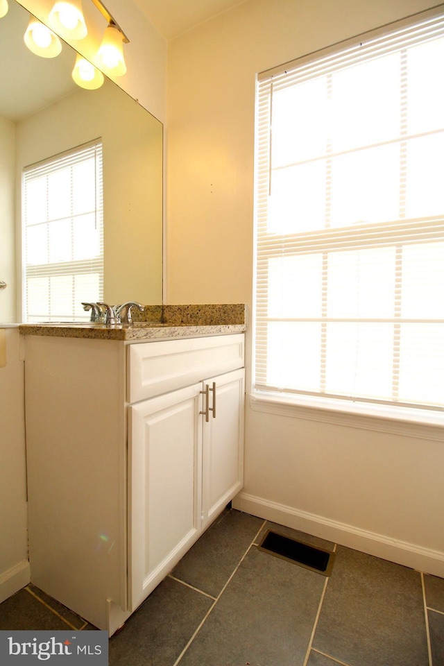 bathroom featuring vanity and tile patterned flooring