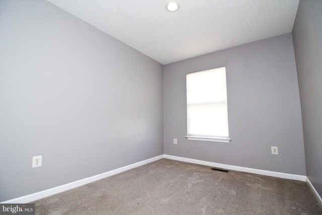 spare room with carpet floors