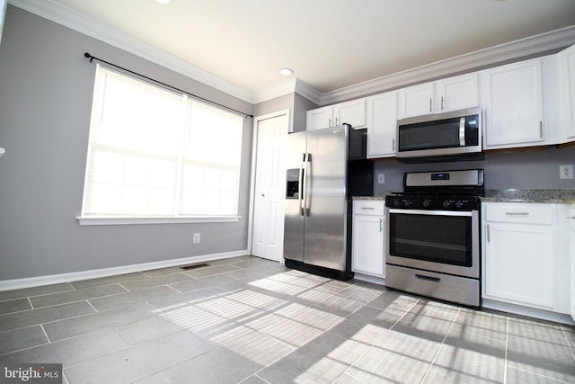 kitchen with white cabinetry, light stone countertops, ornamental molding, and stainless steel appliances