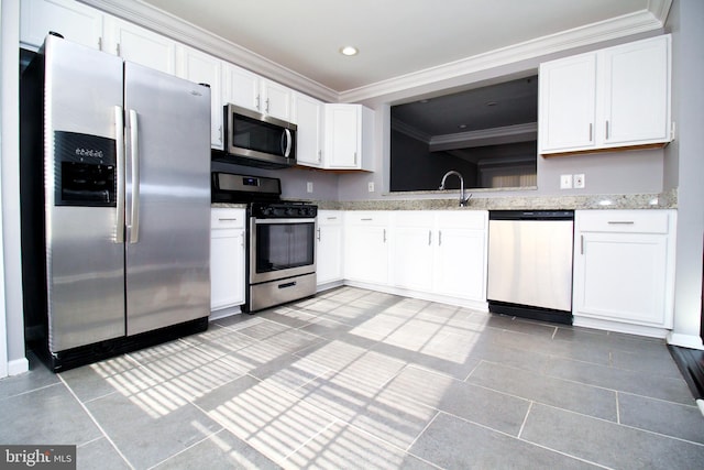 kitchen with crown molding, appliances with stainless steel finishes, sink, and white cabinets