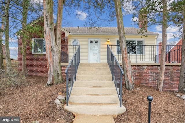 view of front of property featuring brick siding