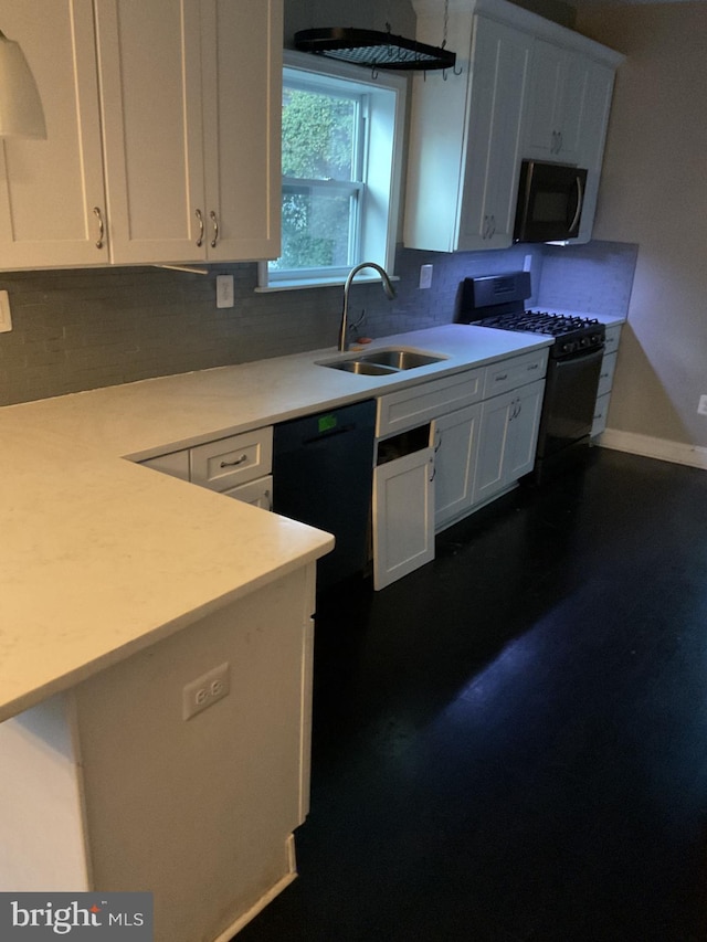 kitchen featuring white cabinetry, gas range, black dishwasher, and sink