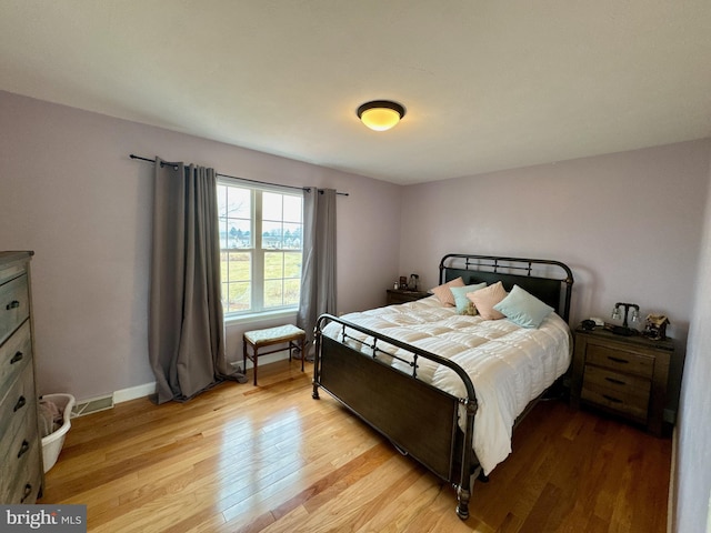 bedroom with light hardwood / wood-style flooring