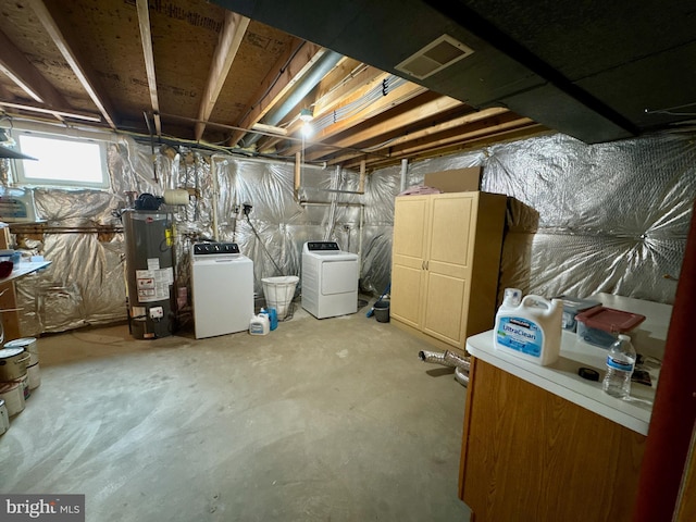 basement featuring separate washer and dryer and gas water heater