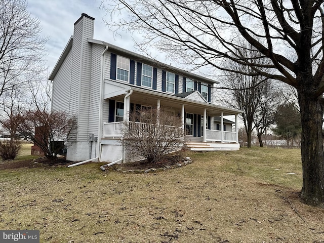 view of front of house featuring a porch and a front yard