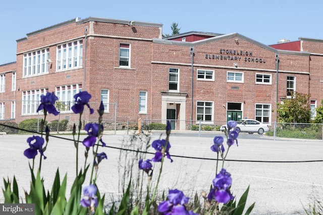 view of building exterior featuring fence