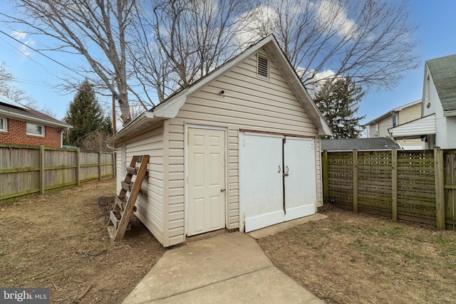 view of shed with a fenced backyard