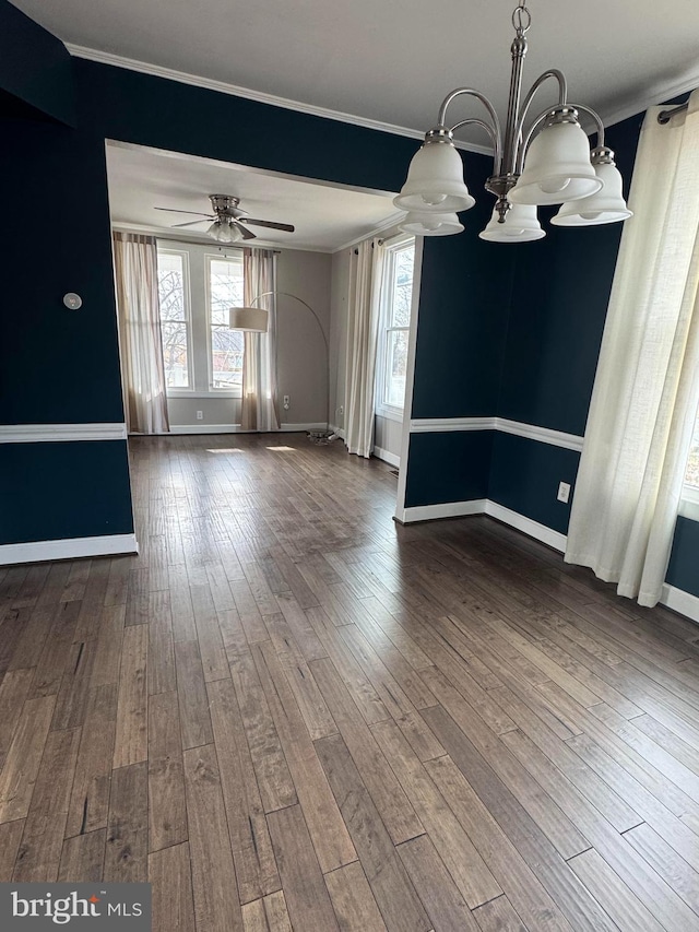 interior space featuring dark wood-style floors, baseboards, and ceiling fan with notable chandelier