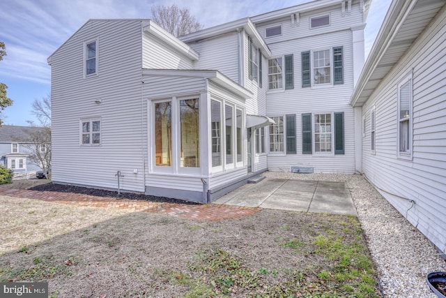 back of property featuring a patio