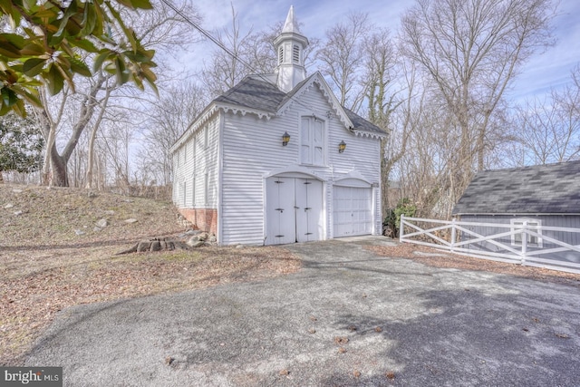 view of side of property featuring a garage