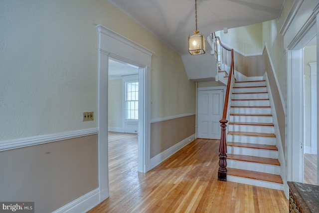 stairway featuring hardwood / wood-style flooring