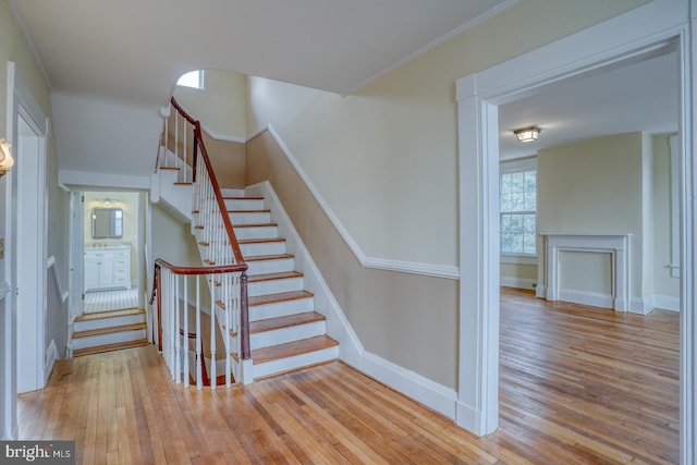 stairway with hardwood / wood-style floors