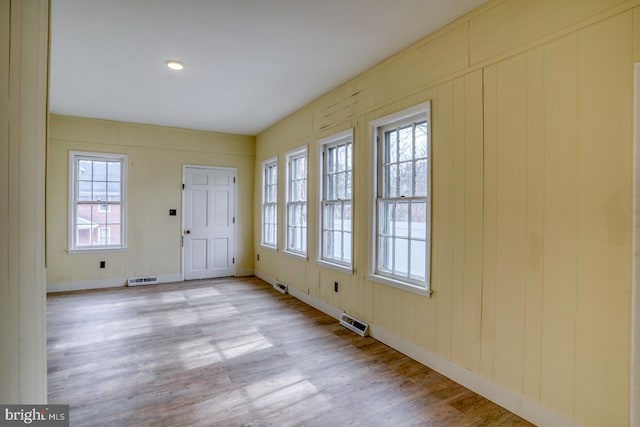 foyer entrance with light hardwood / wood-style floors