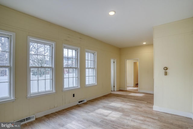 unfurnished room featuring light hardwood / wood-style floors