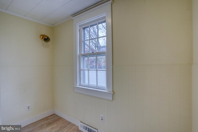 unfurnished room with light hardwood / wood-style flooring