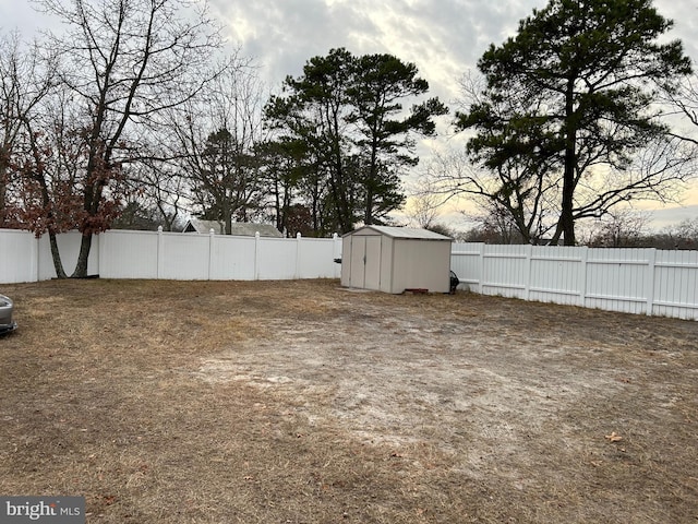 yard at dusk with a storage shed