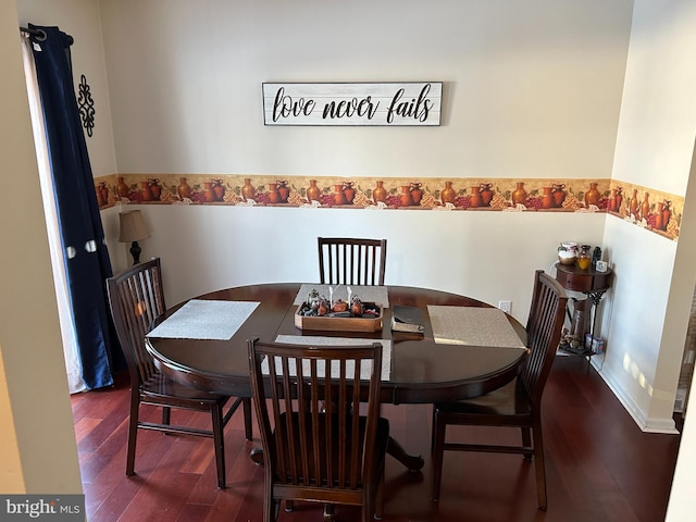 dining area with dark hardwood / wood-style flooring