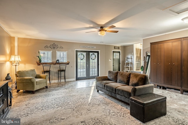 living room featuring french doors, ceiling fan, and ornamental molding