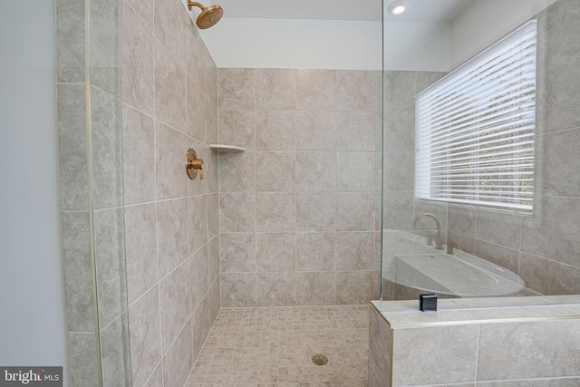 bathroom with a tile shower