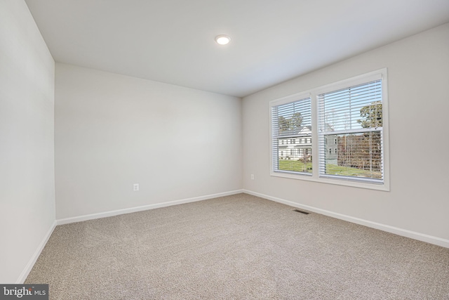 empty room with carpet flooring