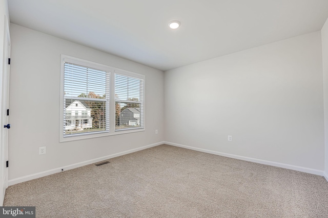 spare room featuring carpet floors