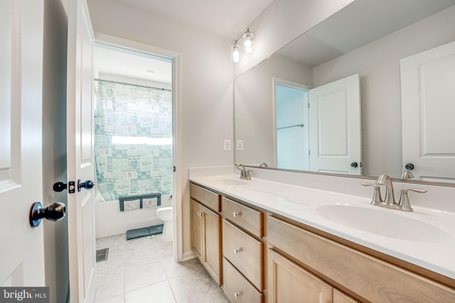 full bathroom featuring tile patterned flooring, vanity, tub / shower combination, and toilet