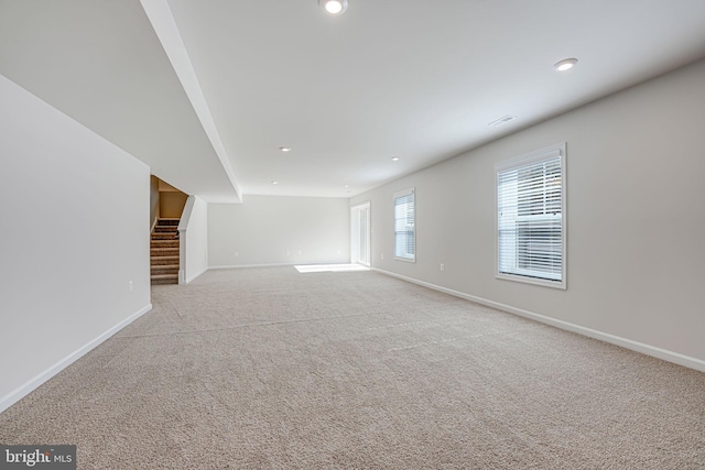 unfurnished living room featuring carpet flooring