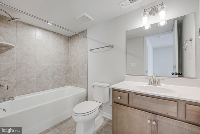 full bathroom with vanity, toilet, tiled shower / bath combo, and tile patterned flooring