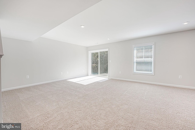 empty room featuring light carpet