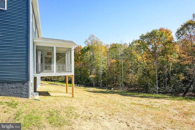 view of yard featuring a sunroom