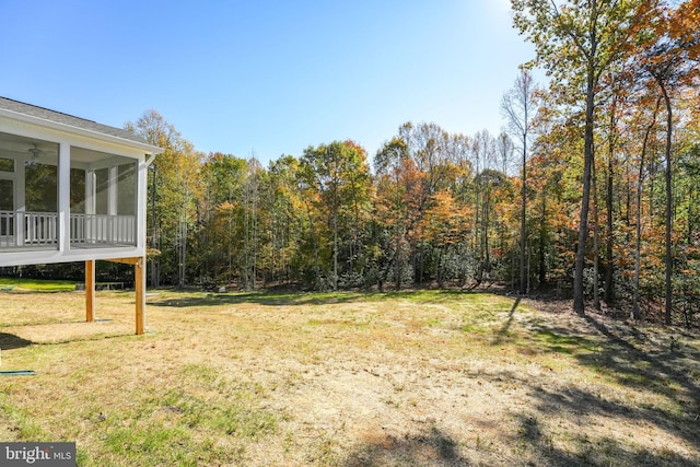 view of yard featuring a sunroom