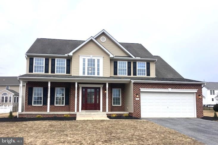 view of front of home featuring a garage and covered porch