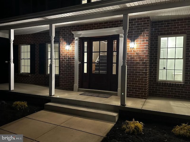 entrance to property featuring a porch