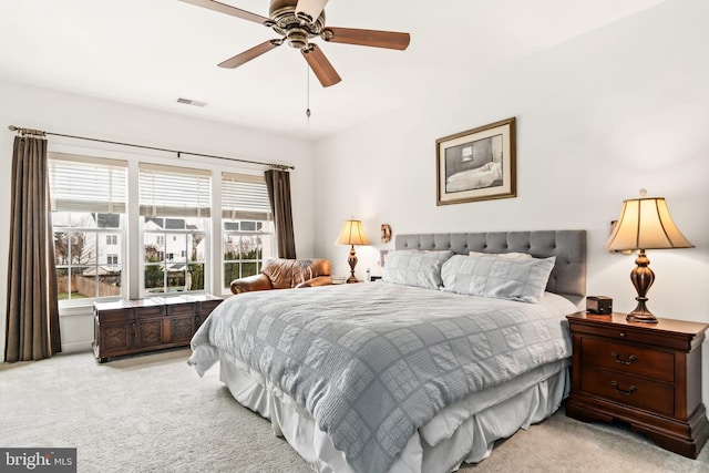 bedroom with light colored carpet and ceiling fan