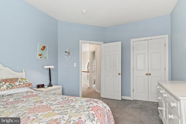 bedroom featuring a closet and carpet flooring