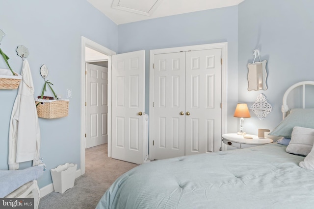 carpeted bedroom featuring a closet