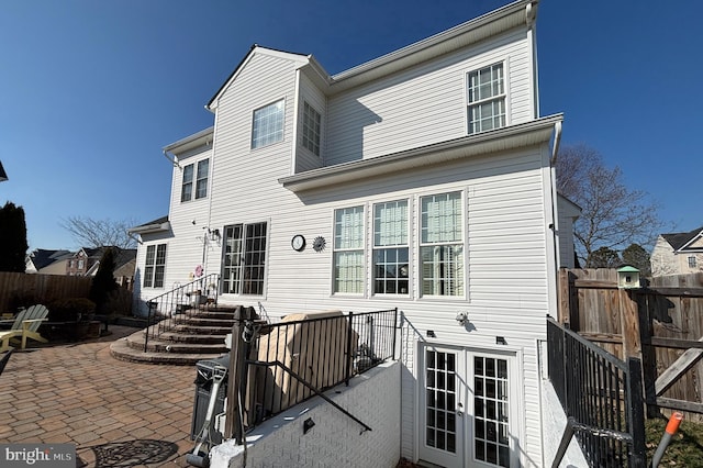 back of house with a patio and french doors