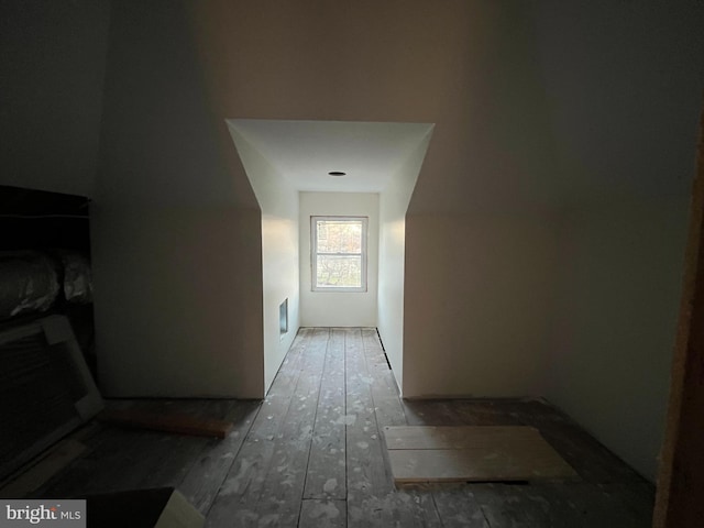 hallway with dark hardwood / wood-style flooring