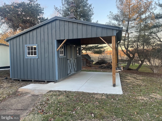 view of outbuilding featuring a lawn