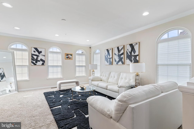 carpeted living room with ornamental molding