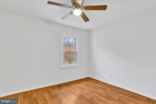 unfurnished room featuring ceiling fan and light wood-type flooring